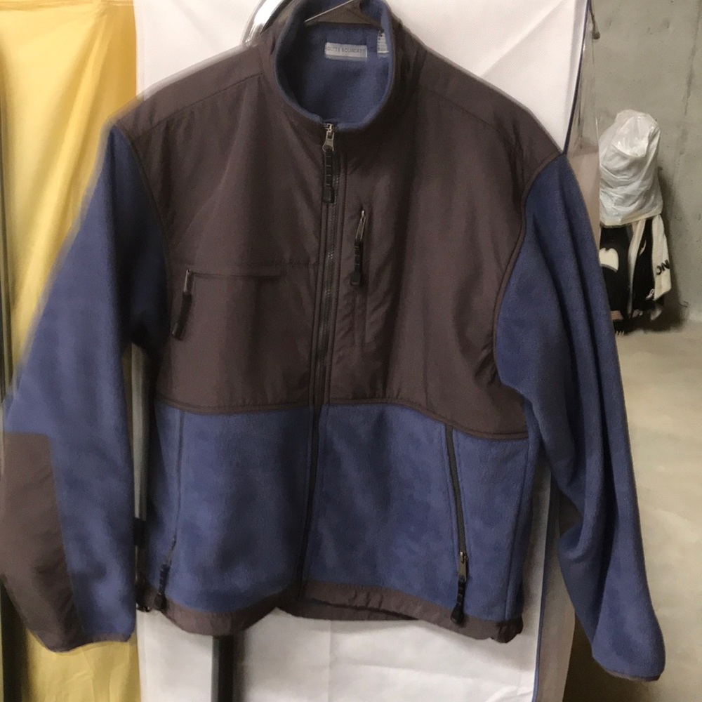 Polar fleece and nylon jacket . Many pockets